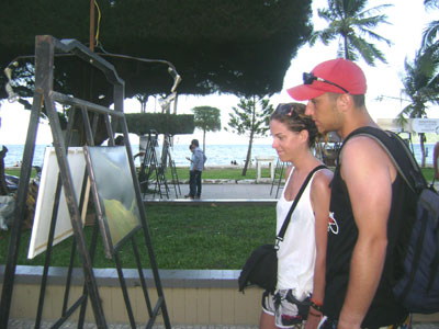 Foreign tourists contemplating photos