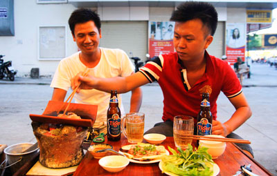 Enjoying tile grilled meat in Nha Trang