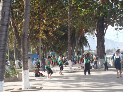 Many people come to Nha Trang beach park to relax.