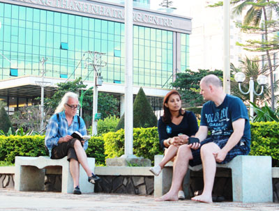 Foreign touirsts relaxing on Nha Trang beach, without being bothered by peddlers.