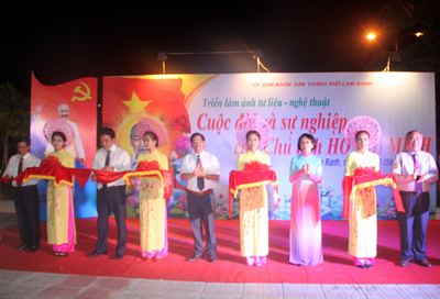 Representatives cutting ribbon to open exhibition about President Ho Chi Minh.