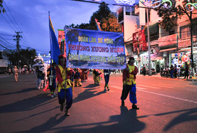 Unicorn – lion – dragon teams parading towards 2-4 Square.