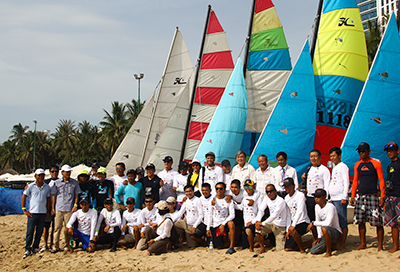 Racers and organization board taking souvenir photo.