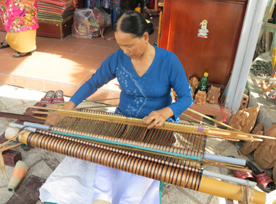 Cham woman by the traditional loom.