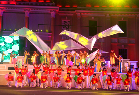 Image of national flag on the stage of street festival.