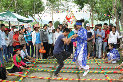 A visitor trying bamboo pole dance.