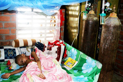 Poor parents care for their little child suffering cancer