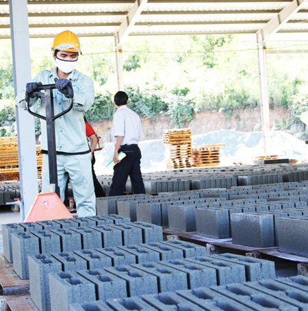 Producing adobe bricks at 