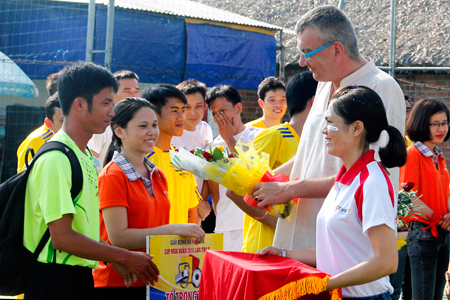 Organization board giving flowers to teams.