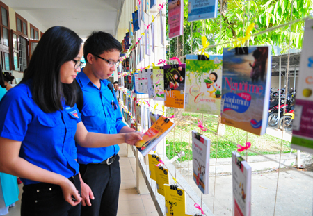 Books are hung, attracting visitors. 