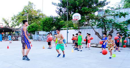 Children playing basketball at provincial Children’s House.