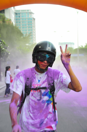 A runner wearing helmet to protect his head.