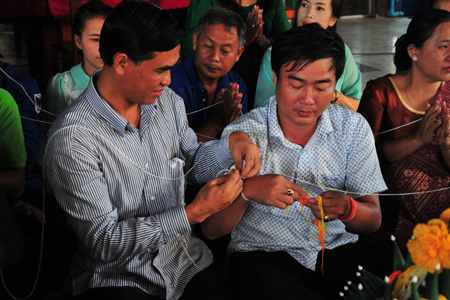 Thread strings tied around wrist to express solidarity, brotherhood between people and good wishes to wearers.