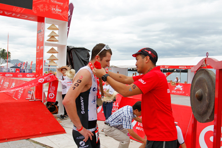 Organization board giving medal to runner-up.