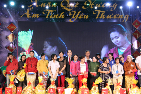 Flood-hit people receiving New Year gifts.