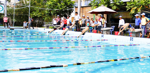 Children competing at summer swimming tournament of Nha Trang