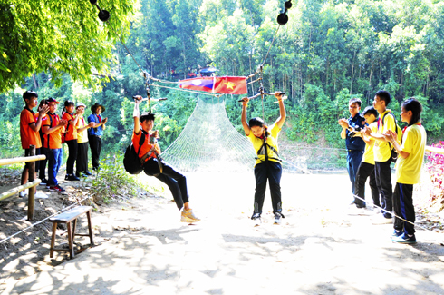 Children of Vietnam and Laos play games at Nhan Tam Ecological Tourist Site.