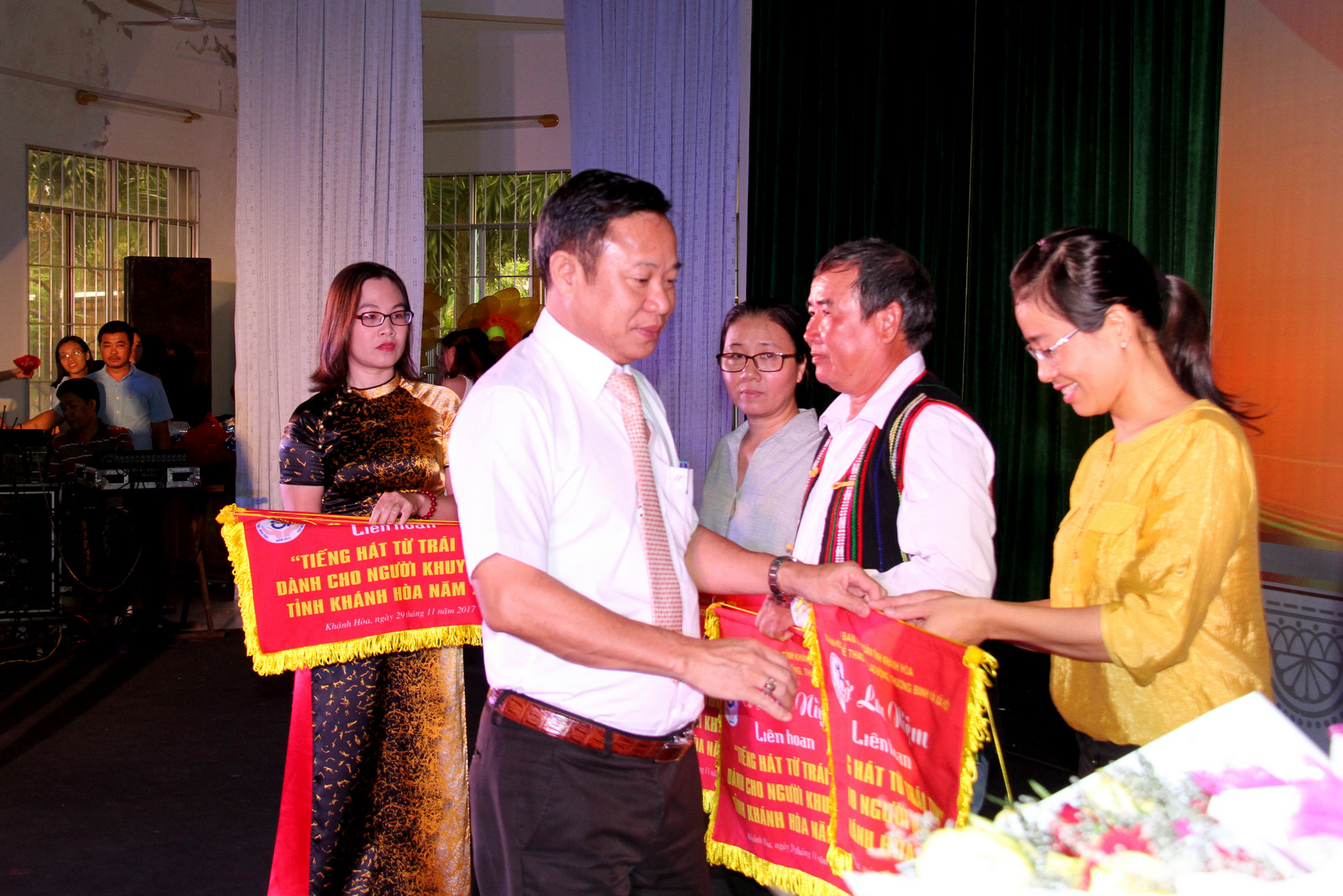 Organizer offering souvenir flags to participating units.