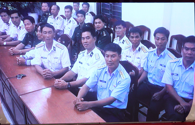 …Lieutenant Nguyen Dinh Hung (front, third from right) working on the Spratly Islands.