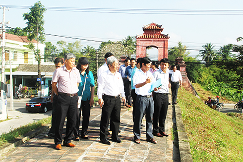 Surveyors examining Dien Khanh Ancient Citadel