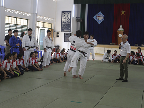 Japanese athletes performing techniques of judo…