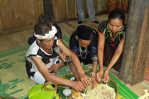 Priest performing ritual of new rice festival