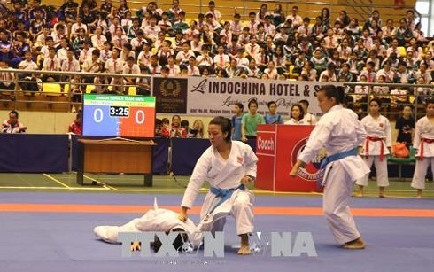 Athletes competing in women’s team kata (Photo: Diep Truong/TTXVN)