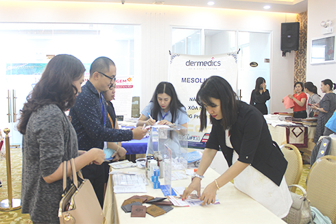 Businesses displaying and introducing products at conference held by VCCI Khanh Hoa