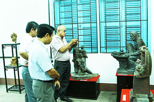 Visitors contemplating exhibits at Khanh Hoa Provincial Museum