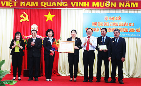 Company leader receiving certificate of merit