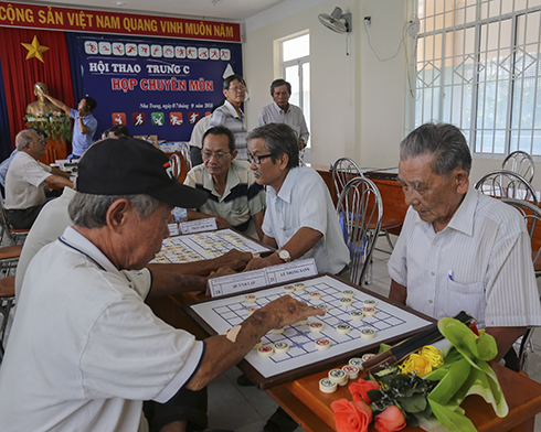 Participants playing Chinese chess