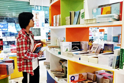 Customer looking for books at a bookstore in Nha Trang