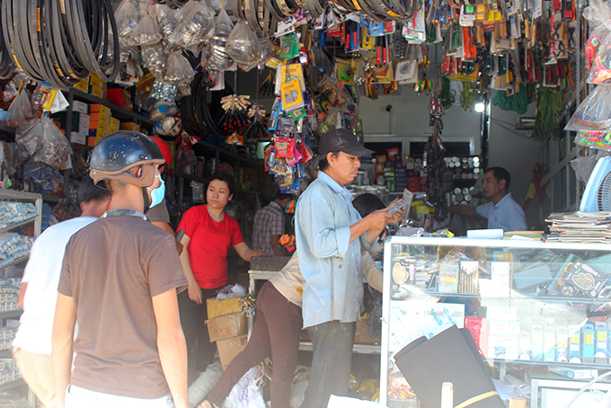 Store is crowded with customers buying materials