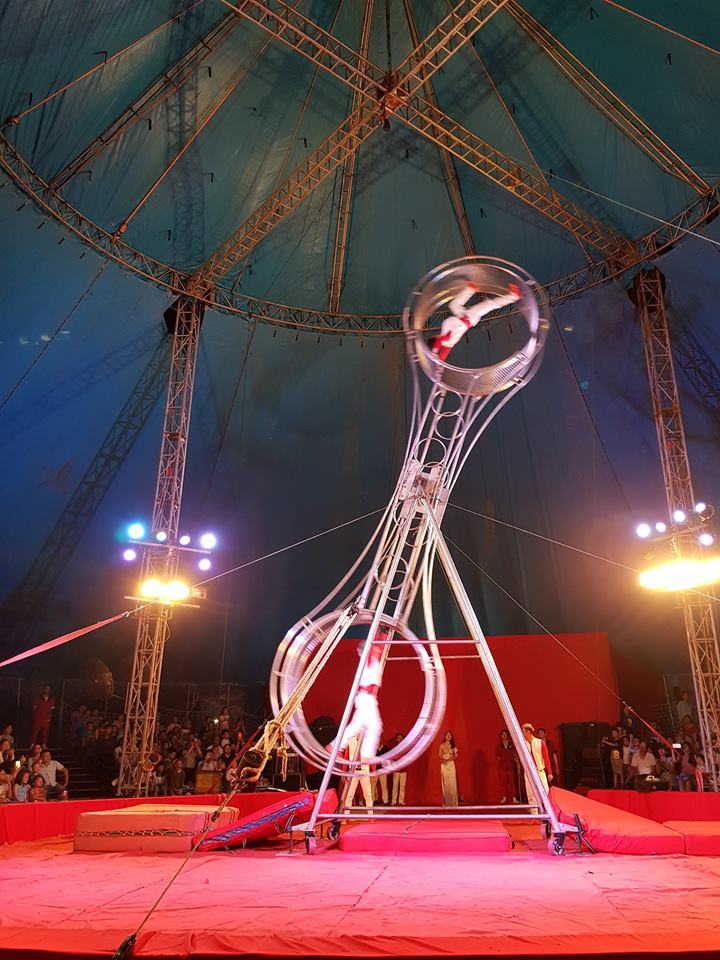 Performing on giant spinning wheel