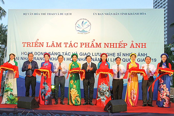 Representative cutting ribbon at opening ceremony