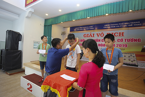 Organization committee giving medals to outstanding individuals