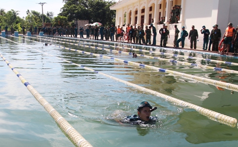 Swimming with gun and light equipment