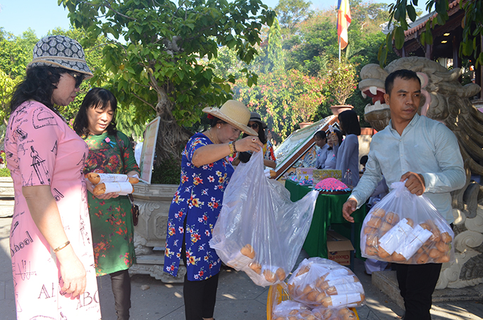 Offering charity bread to people 