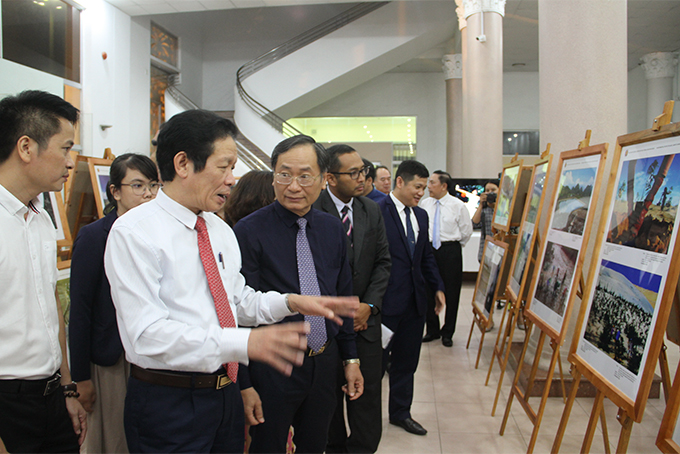 Representatives contemplating exhibits 