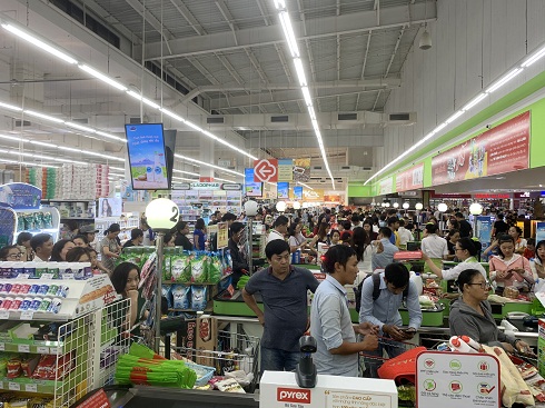 Lines of customers waiting to pay at checkout counters at Big C Supermarket