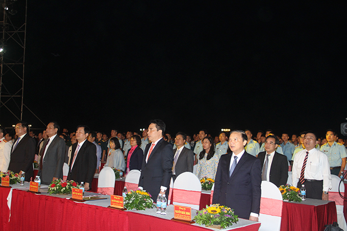 Representatives saluting national flag