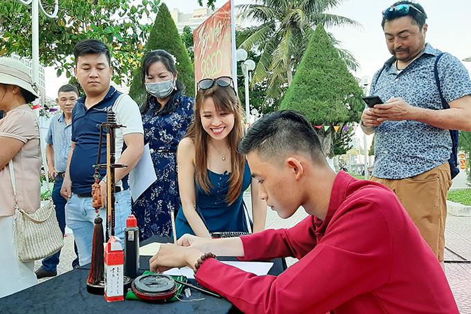 Young calligrapher writing calligraphy