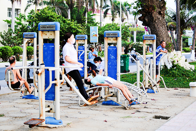 People exercising at beach park