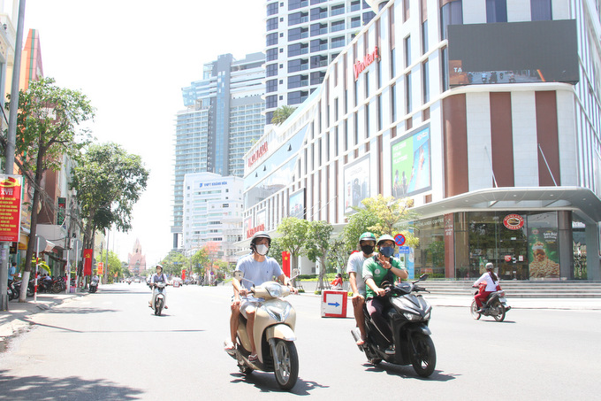 People wear masks when travelling on street