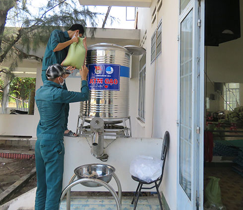 Adding rice to rice ATM’s container