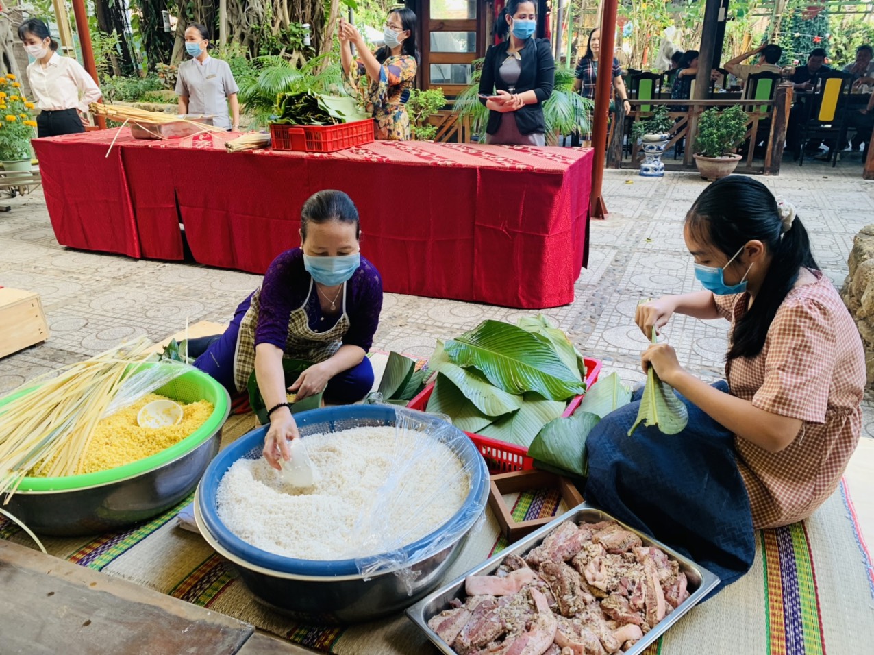 The hotel prepares ingredients to make Banh Chung including glutinous rice, mung beans, pork, and dong leaves