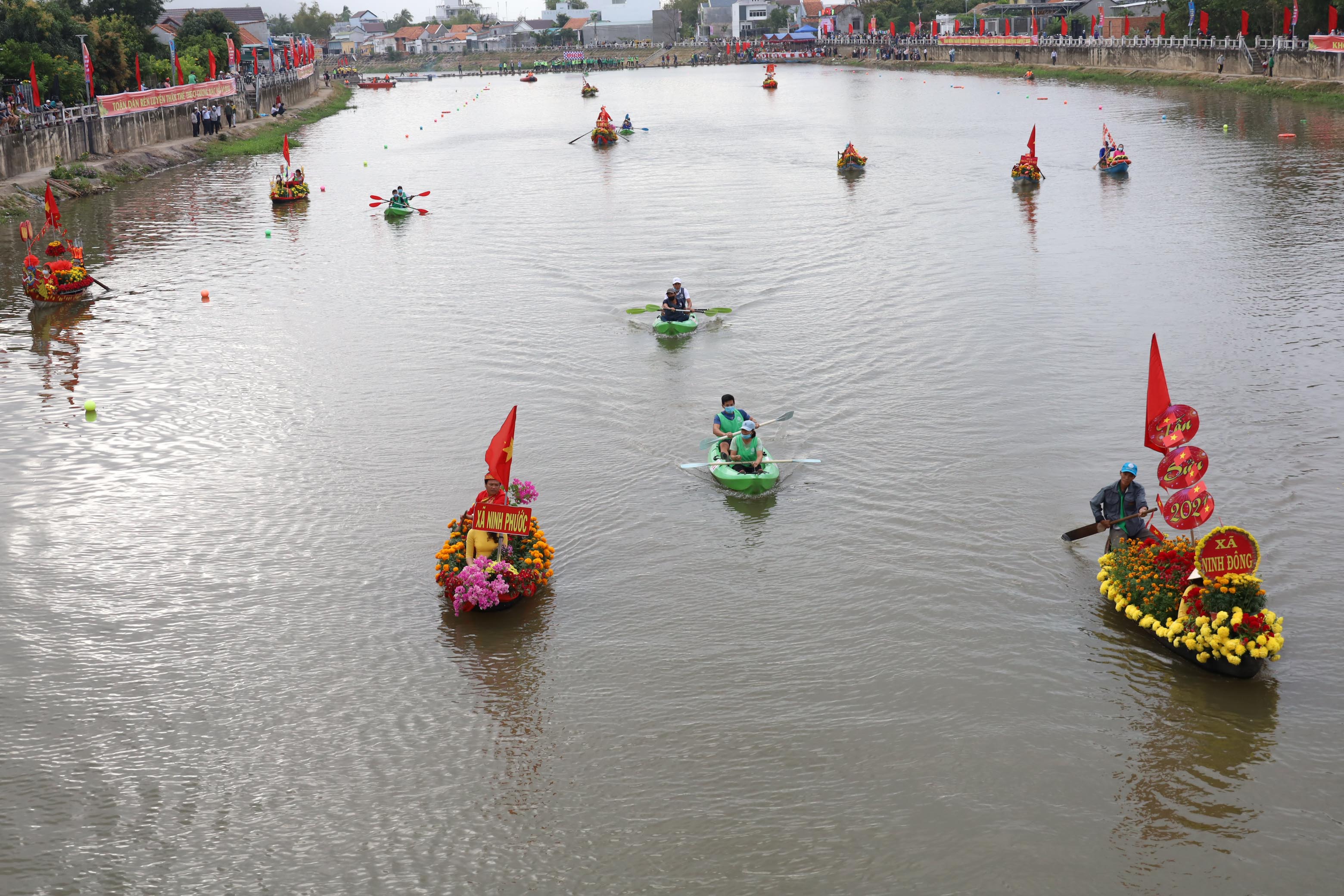 Flower boat festival and boat race on Dinh River