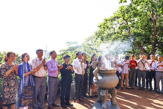 Attendees offering incense at Ponagar Temple