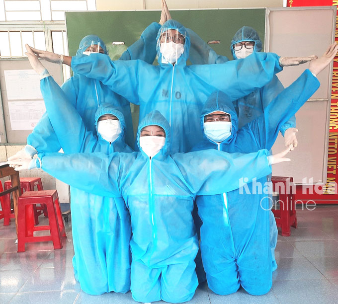 Volunteers do star pose to show their determination in helping the country contain the outbreak