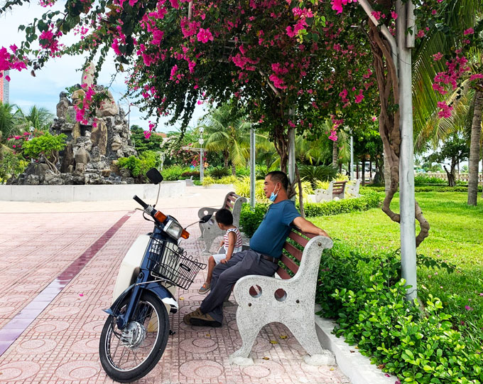 Relaxing under the shade of bougainvillea plants